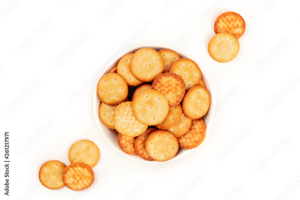An overhead photo of salty crackers in a bowl, shot from the top on a white background with copy space An overhead photo of salty crackers in a bowl, shot from the top on a white background with copy space