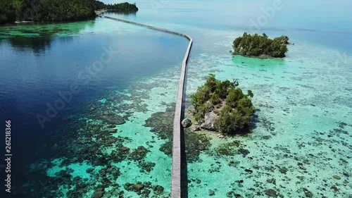 A wooden bridge connecting a sea gypsy bajo village to the main island in the togean islands in Sulawesi in Indonesia