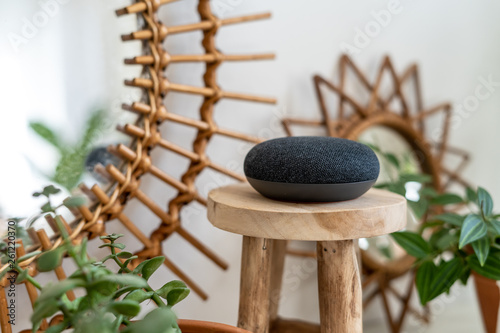 Photography Personal assistant connected loudspeaker on a small wooden table in a living roo