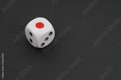 a dice over black surface