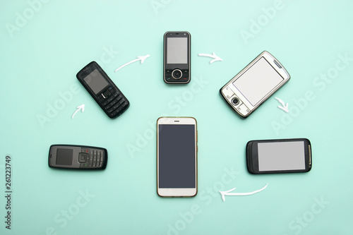 evolution of cell phones. Technology development telephone and pda concept. Vintage and new phones. Top view. Telephone communication progress, mobile classic device . charts, arrows, text around