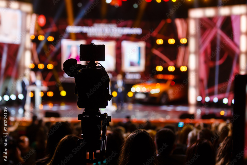 Hall with fans shoots video on camera on concert Hall with fans shoots video on camera on concert