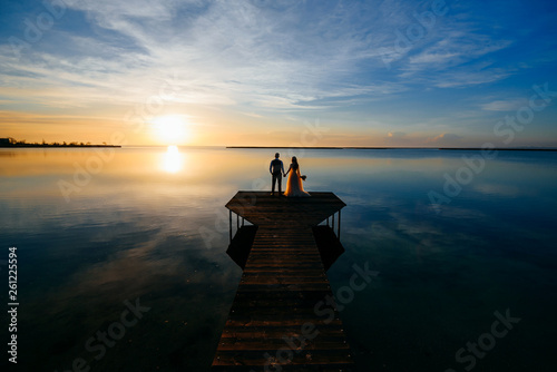couple in love at sunset on the lake