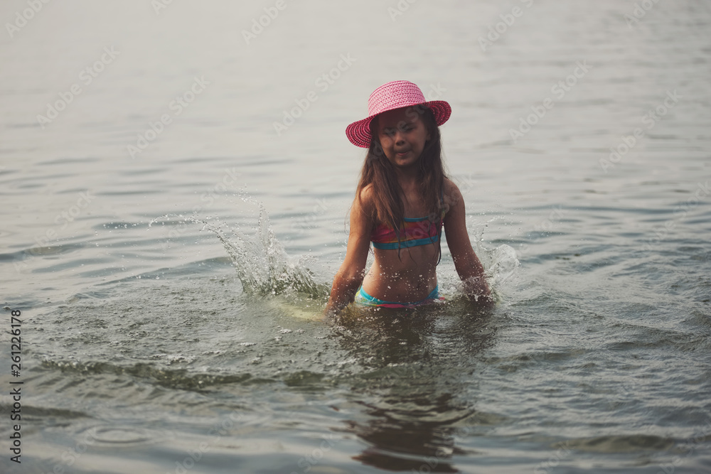 cute happy little girls in sumer lake