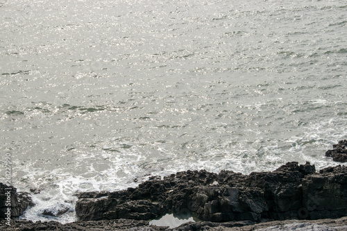 The coastline around gower, Wales with the waves conming into land