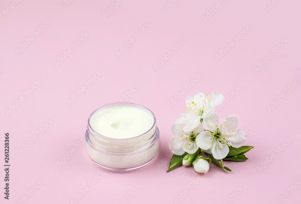Skincare product for face with spring flowers.