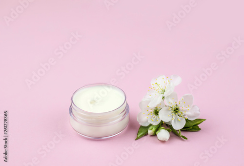 Skincare product for face with spring flowers.