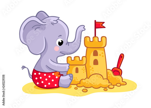 Little elephant plays on the beach in the sand. A cute animal builds a sand castle.