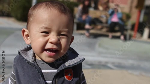 Asian Toddler Baby Laughing At Camera photo