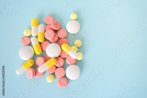 Medical capsules, pills and tablets close-up. Medicine card with copy space.