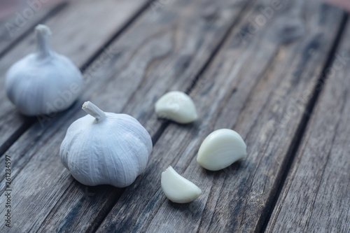 Top view of herbal vegetable ingredients, fresh garlic, on old wooden table, cooking preparation concept