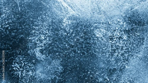 Close-up of melting ice on black background