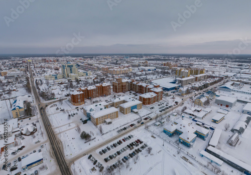 Yugorsk city. Aerial. Winter, snow, cloudy. Khanty Mansiysk Autonomous Okrug (HMAO), Russia.