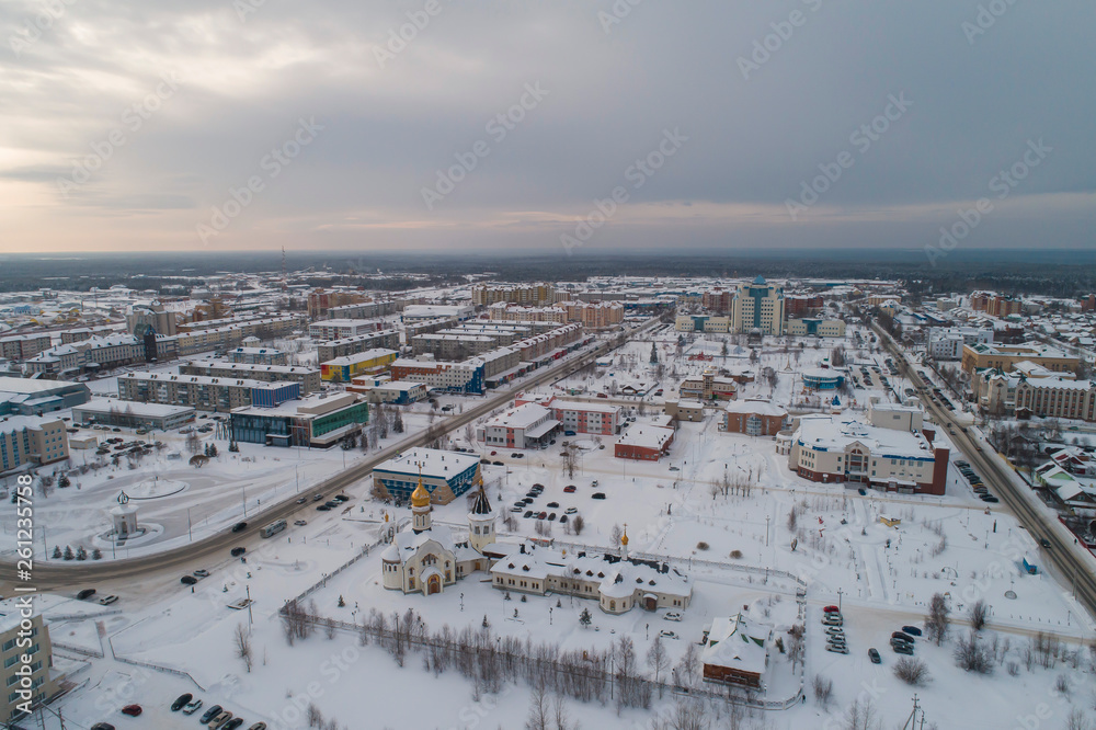 Obraz premium Church in Yugorsk city. Aerial. Winter, snow, cloudy. Khanty Mansiysk Autonomous Okrug (HMAO), Russia.