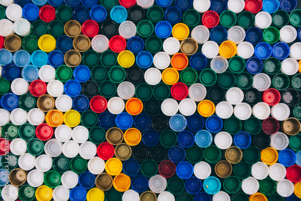 No plastic concept. Pollution problem concept. Colored background of different plastic lids. Say no to single use plastic. Refuse single-use plastic concept No plastic concept. Pollution problem concept. Colored background of different plastic lids. Say no to single use plastic. Refuse single-use plastic concept
