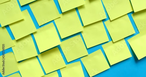 Post it notes on blue wall