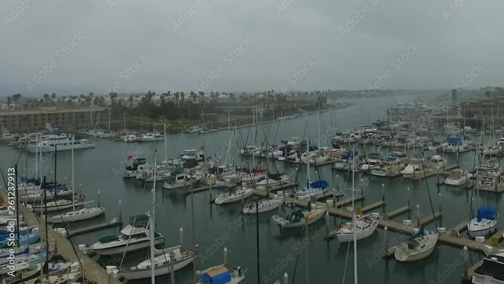 Aerial drone flying over marina harbor with yachts and boats Aerial drone flying over marina harbor with yachts and boats