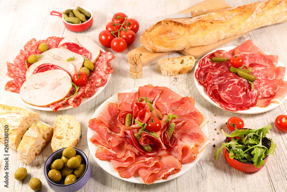 assorted salami, bacon and ham with bread and olive assorted salami, bacon and ham with bread and olive