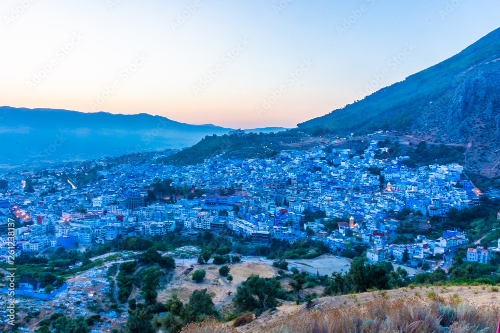 Obraz premium Beautiful sunset over the cityscape of Chefchaouen, the blue city of Morocco