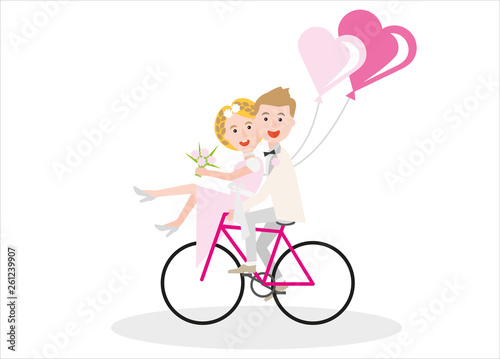 happy young couple just married sitting on a bicycle