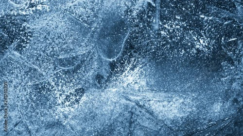 Close-up of melting ice on black background