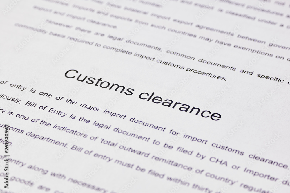 Page of paper with words Customs Clearance. Close-up Page of paper with words Customs Clearance. Close-up