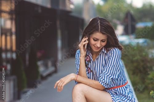 brunette girl talking on the phone 