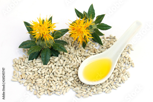 Safflower seeds and oil. photo