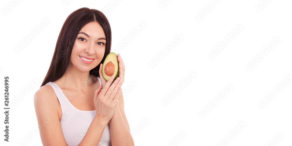 Cute woman with beautiful smile holding avocado. Cute woman with beautiful smile holding avocado.
