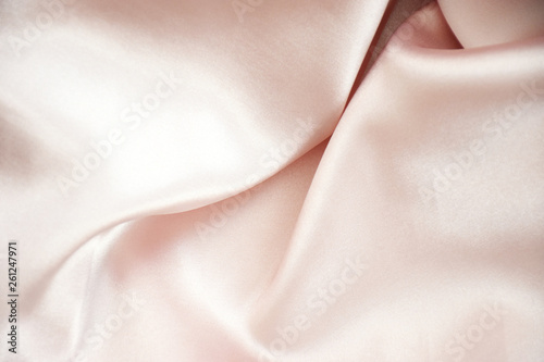 Tender pink pastel textile background with copy space. Pink fabric textures background, fabric uneven. Abstract blur of pink fabric for Wedding background. Pink silk fabric defocused for background.