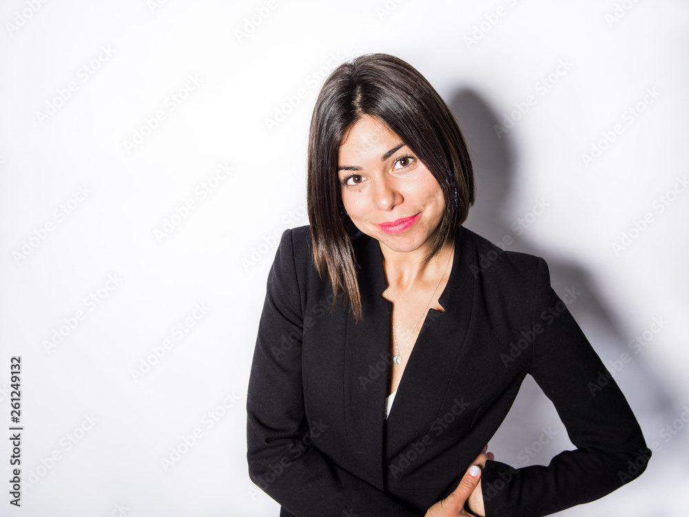 Business woman wearing a black suit posing in a studio Business woman wearing a black suit posing in a studio
