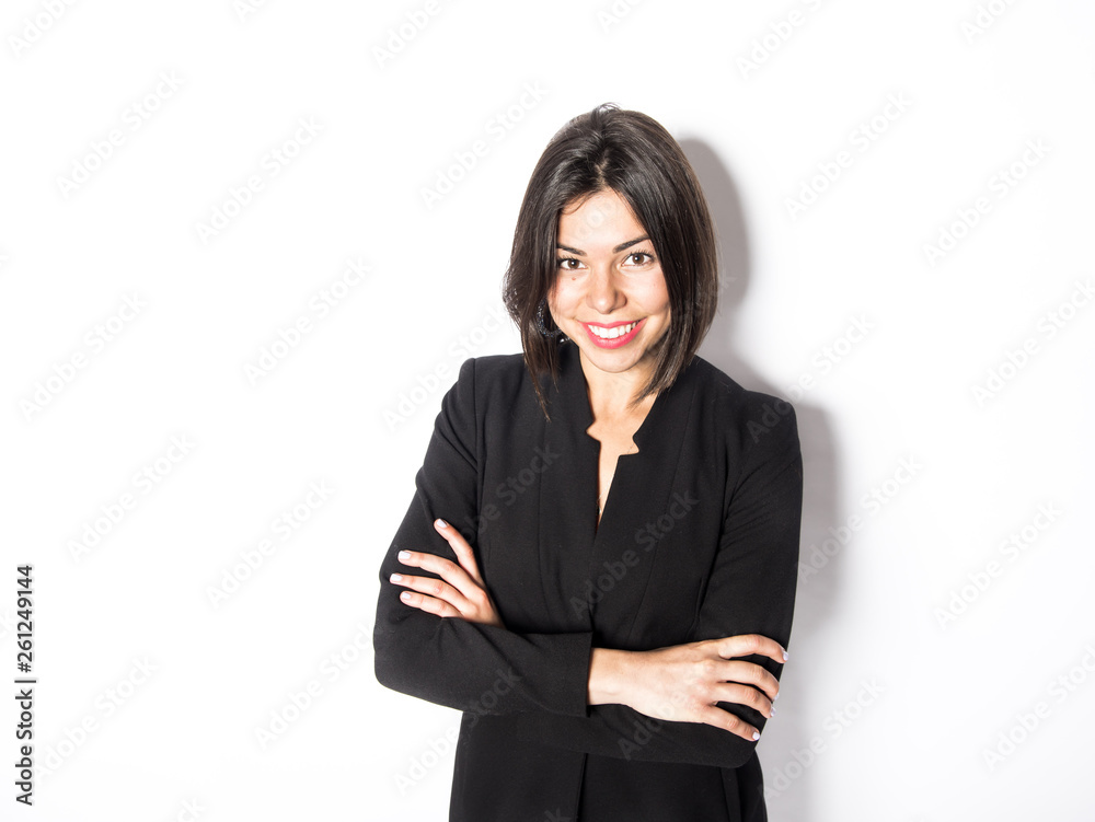 Business woman wearing a black suit posing in a studio Business woman wearing a black suit posing in a studio