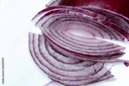 Red onion chopped into thin slices. Image on white background