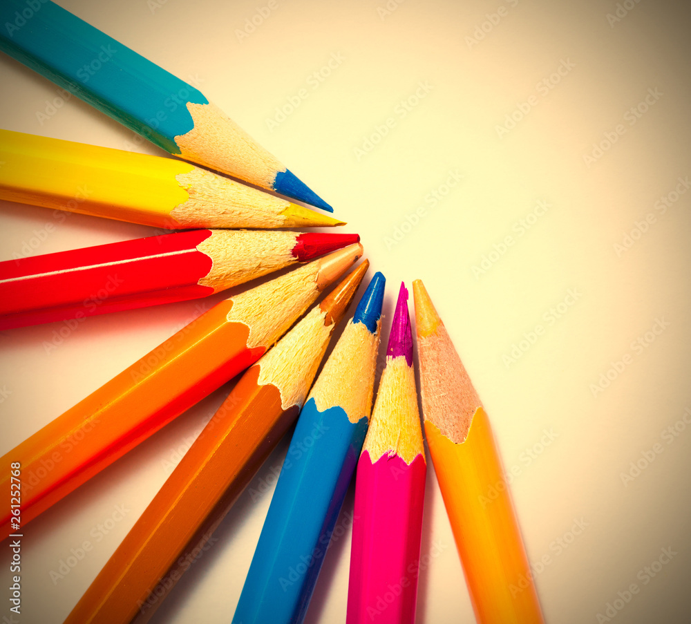 Naklejka premium colored pencils on white