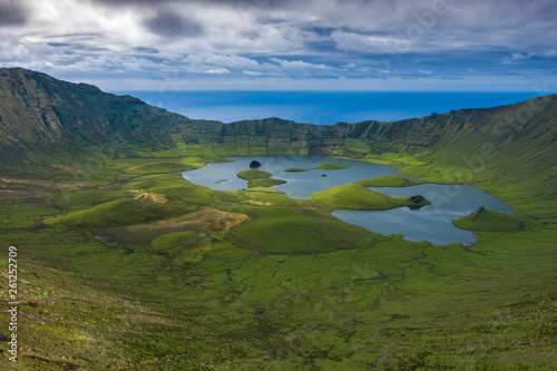 Aerial view of volcanic crater (Caldeirao) with a beautiful lake on the top of Corvo island. Azores islands, Portugal. photo