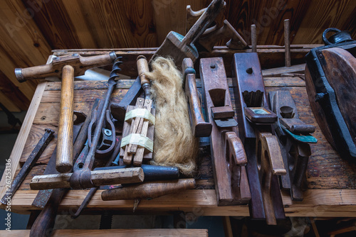 Historical tools in shipyard in Sarilhos Pequenos, small village near Moita, Portugal photo