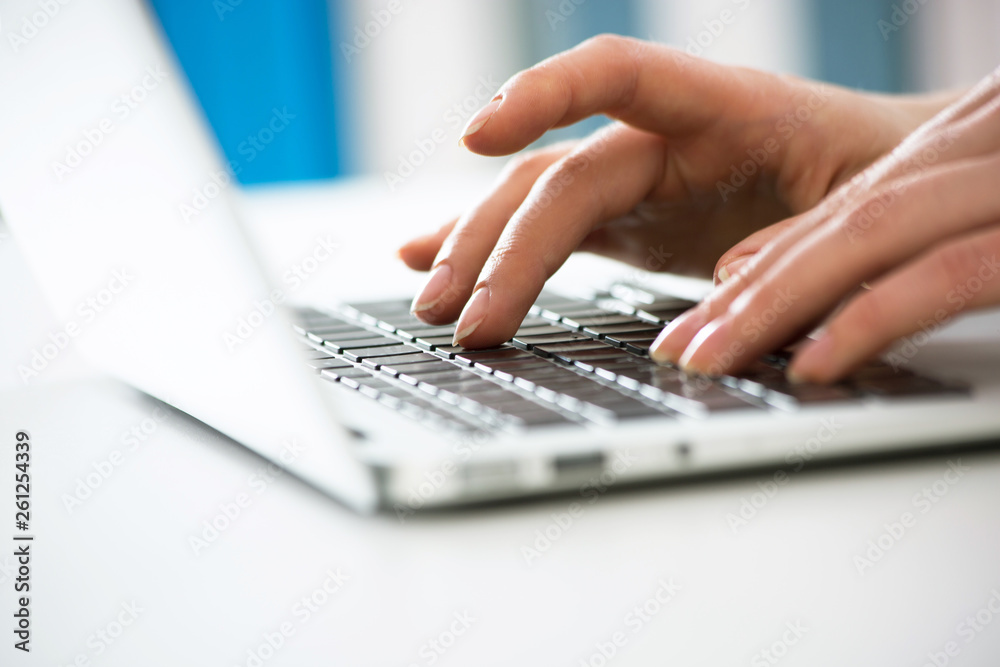 Close-up of hands of businesswoman typing on a laptop. Close-up of hands of businesswoman typing on a laptop.