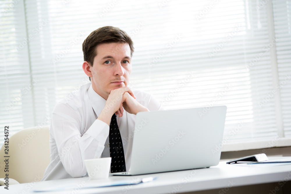 Portrait of businessman in an office Portrait of businessman in an office