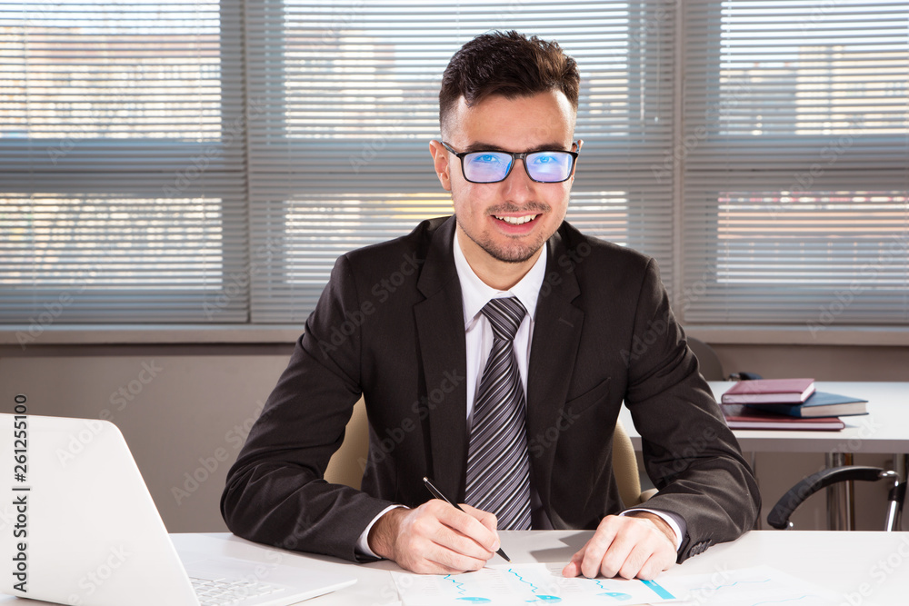 Portrait of businessman working in an office Portrait of businessman working in an office