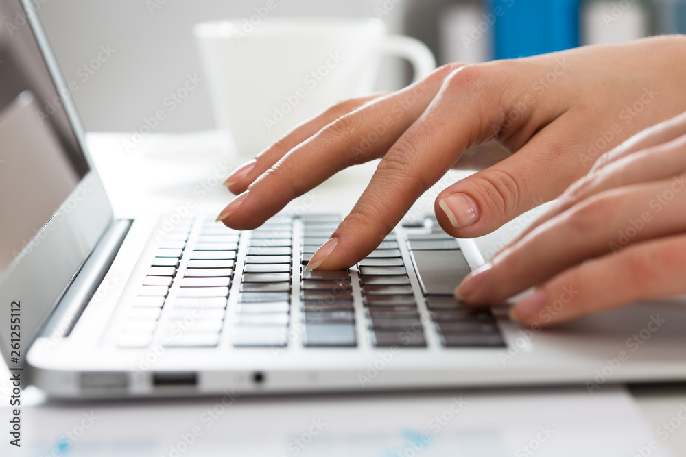 Close-up of hands of businesswoman typing on a laptop. Close-up of hands of businesswoman typing on a laptop.