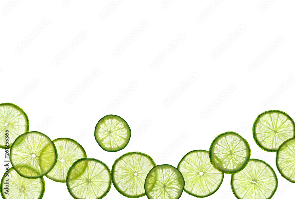 Slices of lime on white background. Copy space for your text. Top view. High resolution product