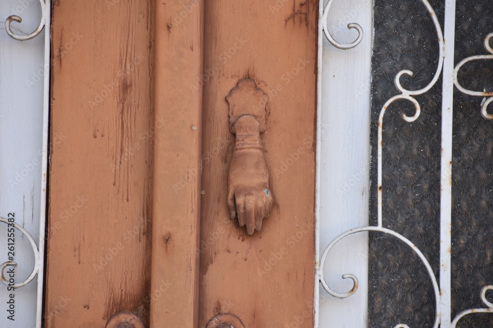 Fototapeta premium Mediterranean Brown Hand Door Knocker