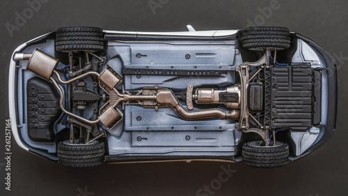 inverted car on a black background. bottom view of car