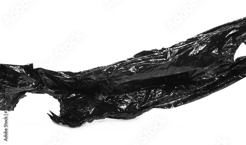 Crumpled plastic black bag isolated on white background