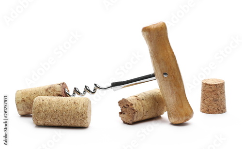 Corkscrew and wine corks isolated on white background