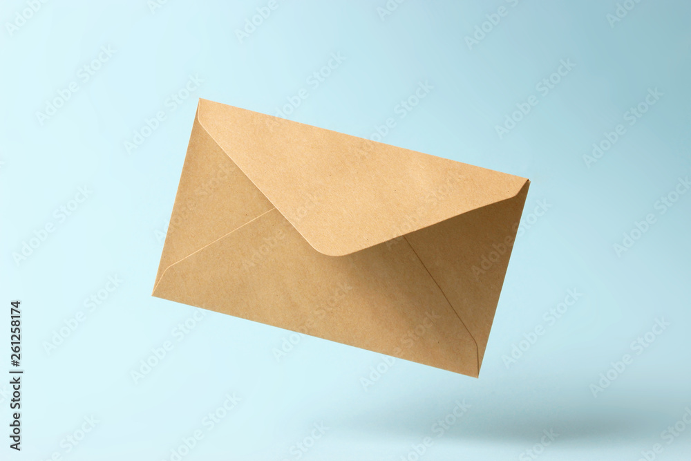 The envelope falls to the ground on a colored background. The envelope falls to the ground on a colored background.