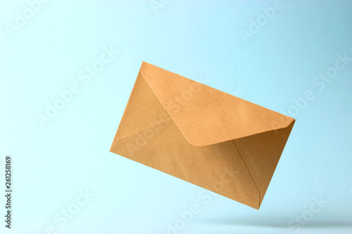 The envelope falls to the ground on a colored background.