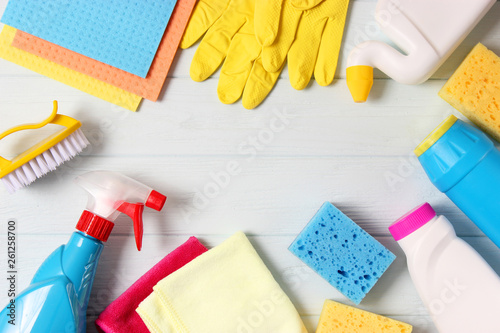  cleaning products on a colored background top view.