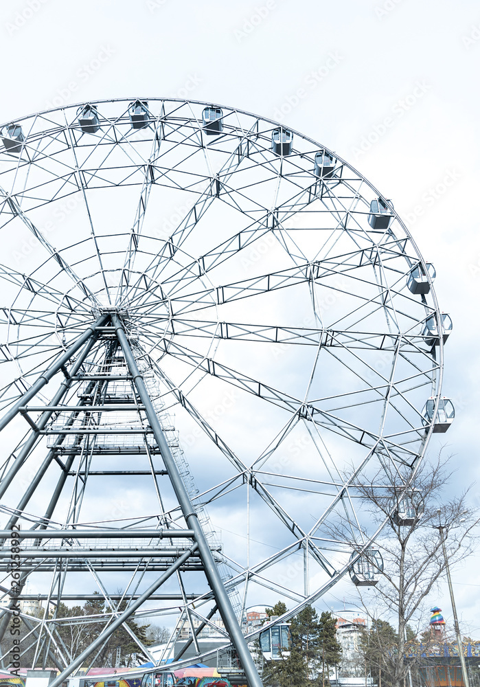 ferris or observation wheel over a blue sky ferris or observation wheel over a blue sky