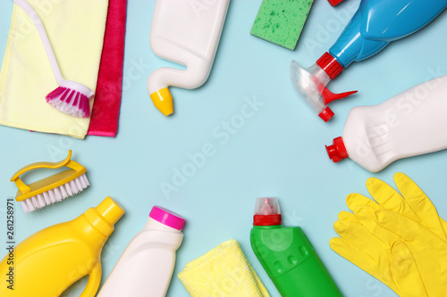  cleaning products on a colored background top view.